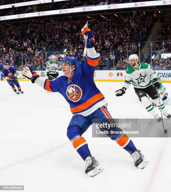 Bo Horvat of the New York Islanders scores the game-winning goal at 41 seconds of overtime against the Dallas Stars at UBS Arena on January 21, 2024...