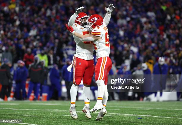 Mike Danna and Leo Chenal of the Kansas City Chiefs celebrate a 44 yard missed field goal attempt kicked by Tyler Bass of the Buffalo Bills during...