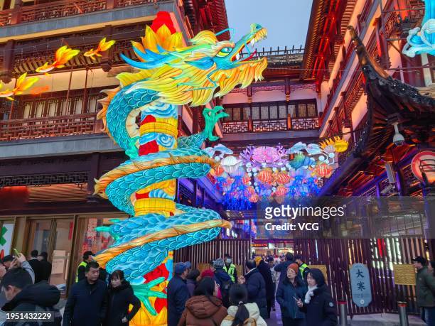 Tourists visit the Yuyuan Garden Lantern Show ahead of Chinese New Year, the Year of the Dragon, on January 21, 2024 in Shanghai, China. The annual...