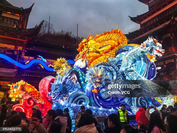 Tourists visit the Yuyuan Garden Lantern Show ahead of Chinese New Year, the Year of the Dragon, on January 21, 2024 in Shanghai, China. The annual...