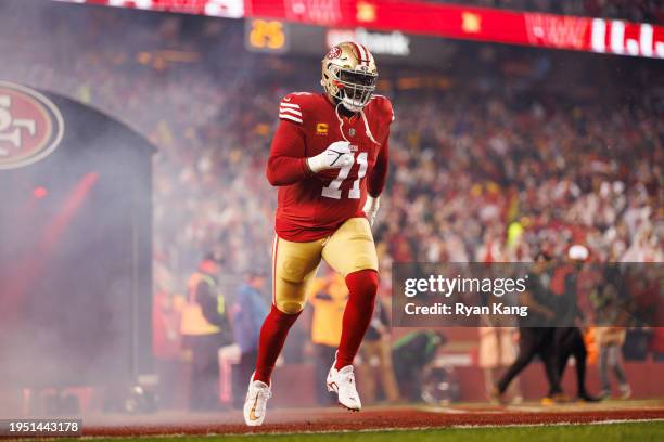 Trent Williams of the San Francisco 49ers runs onto the field during player introductions before an NFC divisional round playoff football game...