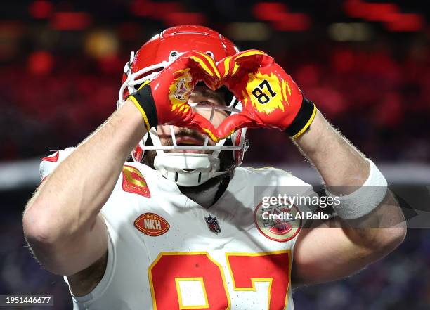 Travis Kelce of the Kansas City Chiefs celebrates after scoring a 22 yard touchdown against the Buffalo Bills during the second quarter in the AFC...