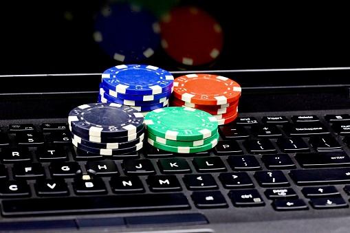 Online gambling - computer keyboard and poker chips
