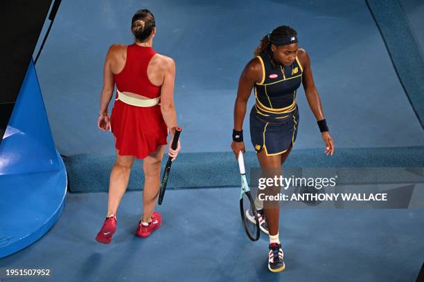 Belarus' Aryna Sabalenka and USA's Coco Gauff walk past during a break in their women's singles semi-final match on day 12 of the Australian Open...