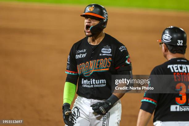 Andretty Cordero of Naranjeros celebrates reaching base in the fourth inning of game 2 of the LMP finals between Naranjeros of Hermosillo and Venados...