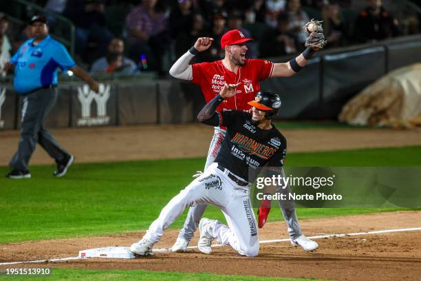 Alex Liddi of Venados puts out runner Aaron Altherr of Naranjeros at third base in the fifth inning of game 2 of the LMP finals between Naranjeros of...