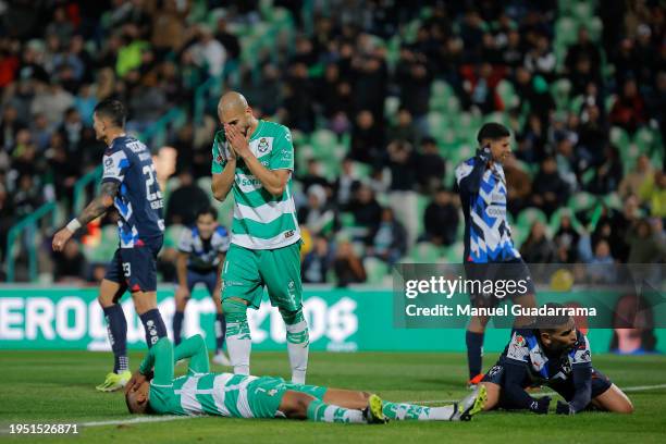 Harold Preciado and Matheus Doria of Santos react after a shot during the 2nd round match between Santos Laguna and Monterrey as part of the Torneo...