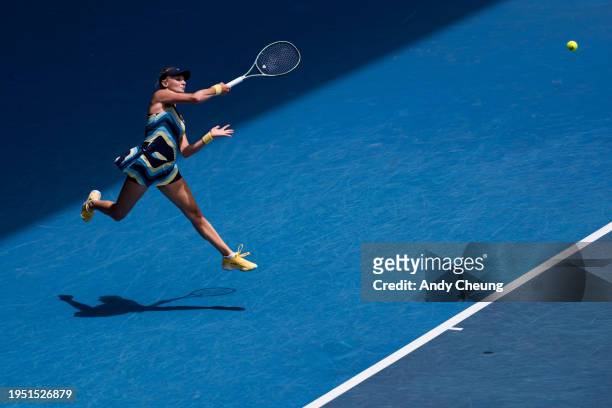 Dayana Yastremska of Ukraine lunges to play a forehand during their round four singles match against Victoria Azarenka during day nine of the 2024...