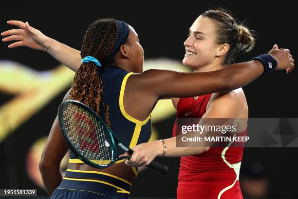 Belarus' Aryna Sabalenka embraces USA's Coco Gauff after their women's singles semi-final match on day 12 of the Australian Open tennis tournament in...