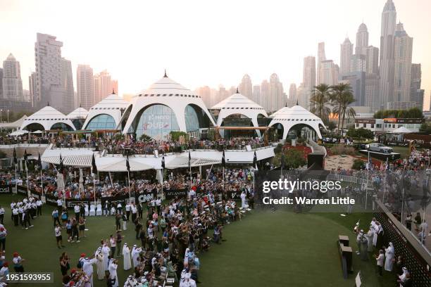 Rory McIlroy of Northern Ireland lifts the trophy after the final round of the Hero Dubai Desert Classic at Emirates Golf Club on January 21, 2024 in...