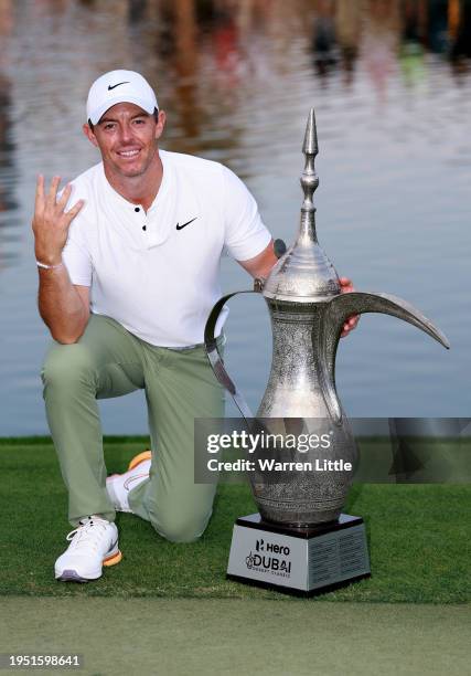 Rory McIlroy of Northern Ireland poses with the trophy after winning the Hero Dubai Desert Classic at Emirates Golf Club on January 21, 2024 in...