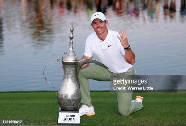 Rory McIlroy of Northern Ireland poses with the trophy after winning the Hero Dubai Desert Classic at Emirates Golf Club on January 21, 2024 in...