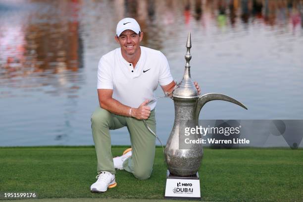 Rory McIlroy of Northern Ireland poses with the trophy after winning the Hero Dubai Desert Classic at Emirates Golf Club on January 21, 2024 in...