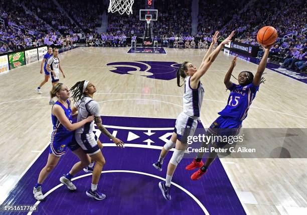 Zakiyah Franklin of the Kansas Jayhawks puts up a shot against Gisela Sanchez of the Kansas State Wildcats in the second half at Bramlage Coliseum on...