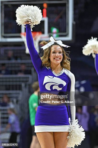 Kansas State Wildcats cheerleader performs during a game against the Oklahoma State Cowboys at Bramlage Coliseum on January 20, 2024 in Manhattan,...