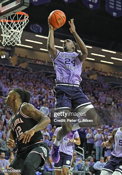 Arthur Kaluma of the Kansas State Wildcats goes up to the basket in the second half against Javon Small of the Oklahoma State Cowboys at Bramlage...