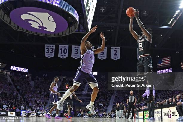 John-Michael Wright of the Oklahoma State Cowboys put up a shot against Dai Dai Ames of the Kansas State Wildcats in the first half at Bramlage...