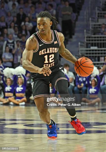 Javon Small of the Oklahoma State Cowboys dribbles the ball down court in the first half against the Kansas State Wildcats at Bramlage Coliseum on...