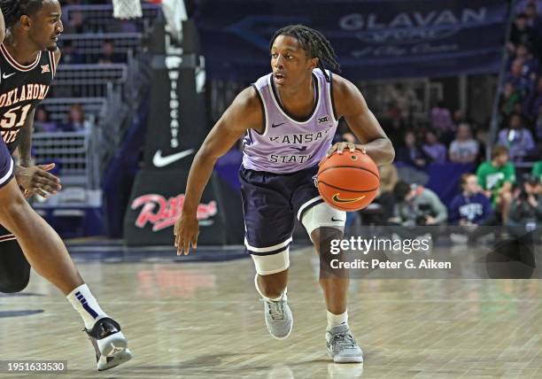 Dai Dai Ames of the Kansas State Wildcats dribbles the ball down court against the Oklahoma State Cowboys in the second half at Bramlage Coliseum on...