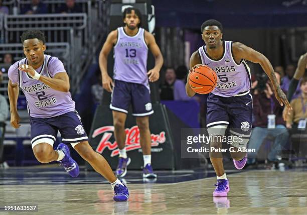 Cam Carter of the Kansas State Wildcats dribbles the ball down court in the second half against the Oklahoma State Cowboys at Bramlage Coliseum on...