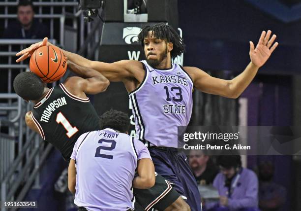 Will McNair Jr. #13 of the Kansas State Wildcats blocks the shot of Bryce Thompson of the Oklahoma State Cowboys in the second half at Bramlage...