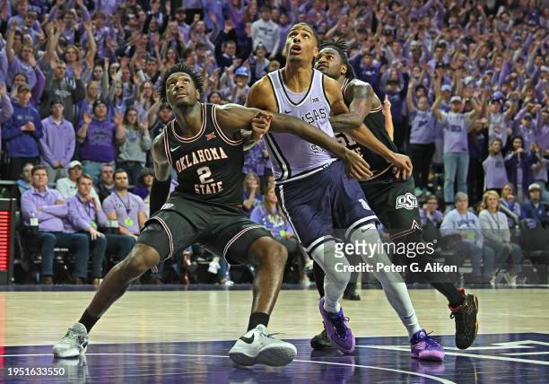 Eric Dailey Jr. #2 of the Oklahoma State Cowboys blocks out David N'Guessan of the Kansas State Wildcats in the second half at Bramlage Coliseum on...
