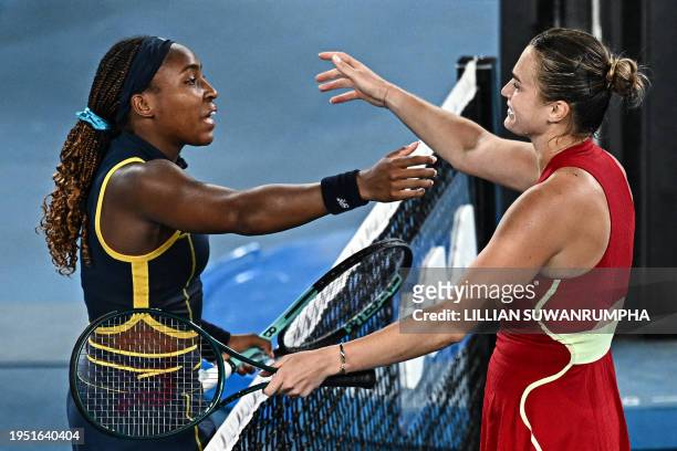 Belarus' Aryna Sabalenka greets USA's Coco Gauff after victory in their women's singles semi-final match on day 12 of the Australian Open tennis...