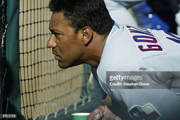 Juan Gonzalez of the Texas Rangers watches from the dugout during the game against the Anaheim Angels at Edison Field on April 2, 2003 in Anaheim,...