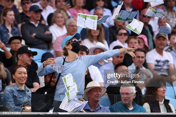 Protester throws paper onto Margaret Court Arena during the round four singles match between Alexander Zverev of Germany and Cameron Norrie of United...