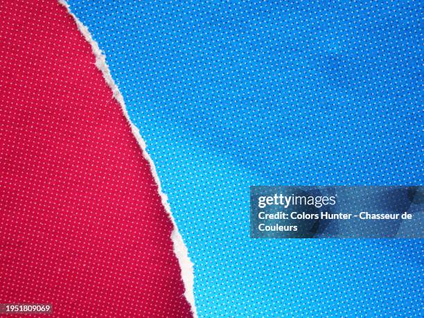 close-up of red and blue posters printed with a colored dots mesh in paris, france. the blue poster is torn and the fiber of the paper is visible on the edge. sunlight. natural colors. - abstract dots stock pictures, royalty-free photos & images