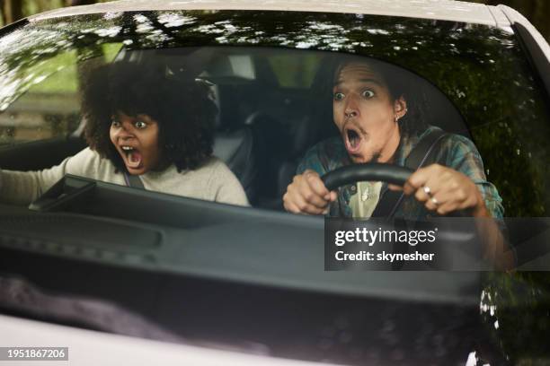 oh my god, we are going to crash! - woman surprised car stock pictures, royalty-free photos & images