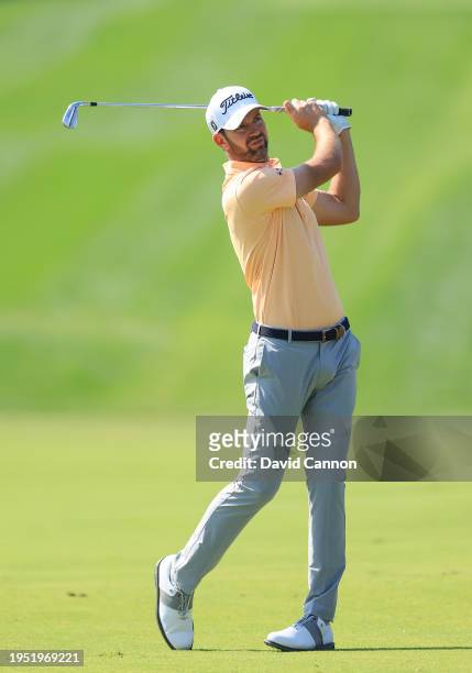 Scott Jamieson of Scotland plays his second shot on the first hole during the final round of the Hero Dubai Desert Classic on The Majlis Course at...