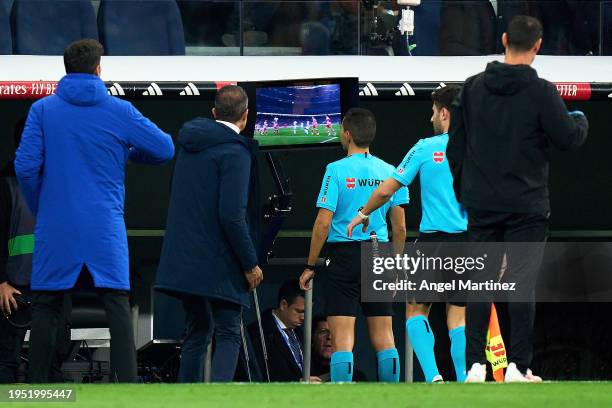 Referee Francisco José Hernández Maeso checks the VAR monitor during the LaLiga EA Sports match between Real Madrid CF and UD Almeria at Estadio...