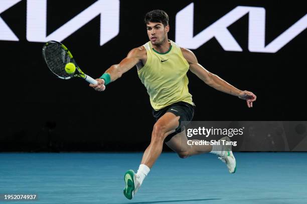 Carlos Alcaraz of Spain plays a forehand in the Men's Singles Fourth Round match against Miomir Kecmanovic of Serbia during day nine of the 2024...