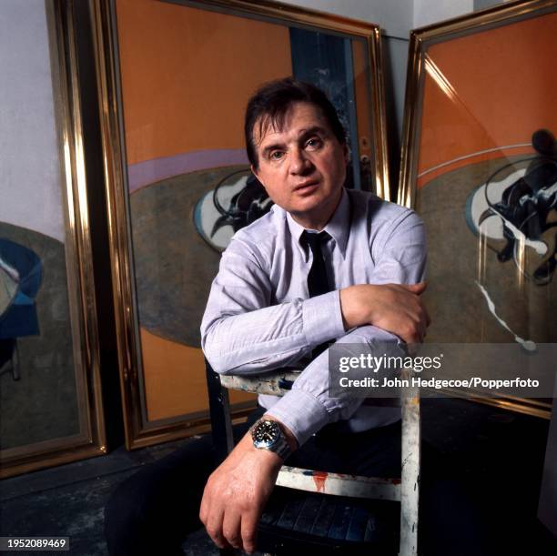 Irish born British artist and painter Francis Bacon posed in his temporary studio space at the Royal College of Art in London in 1969. Visible behind...