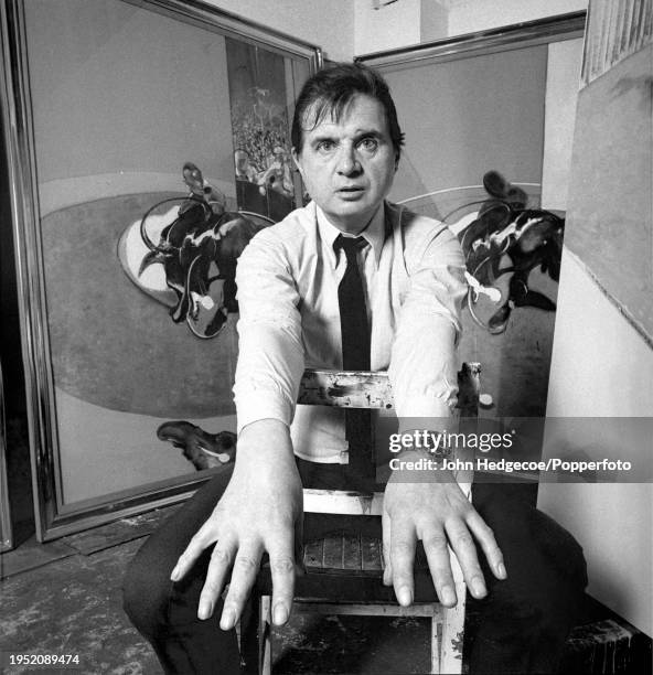Irish born British artist and painter Francis Bacon posed in his temporary studio space at the Royal College of Art in London in 1969. Visible behind...