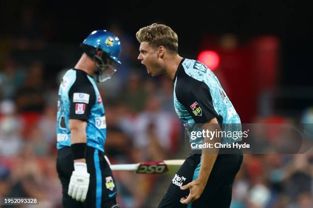 Spencer Johnson of the Heat celebrates dismissing D'Arcy Short of the Strikers during the BBL The Challenger Final match between Brisbane Heat and...