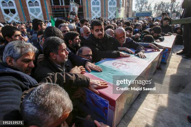 Mourners attend the funeral ceremony of two Iranian Revolutionary Guard members who were killed in an air strike in Syria, on January 22, 2024 in...