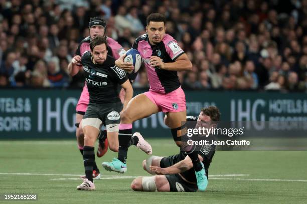 Ben Thomas of Cardiff Rugby between Clovis le Bail and Will Rowlands of Racing 92 during the Investec Champions Cup match between Racing 92 and...