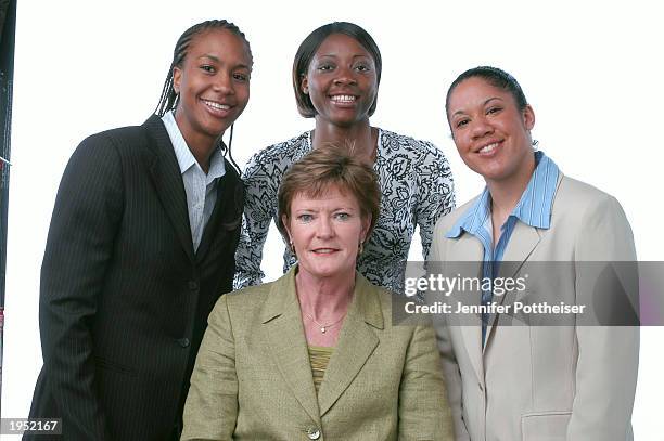 University of Tennessee players Tamika Catchings and Gwen Jackson of the Indiana Fever and Kara Lawson of the Detroit Shock pose with Coach Pat...