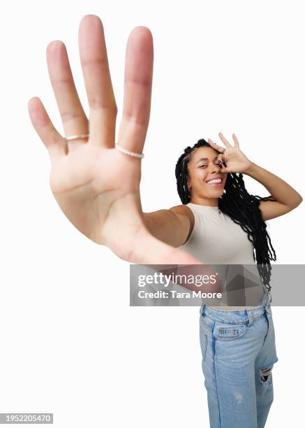 wide angle image of woman gesturing to camera - monocle stock pictures, royalty-free photos & images