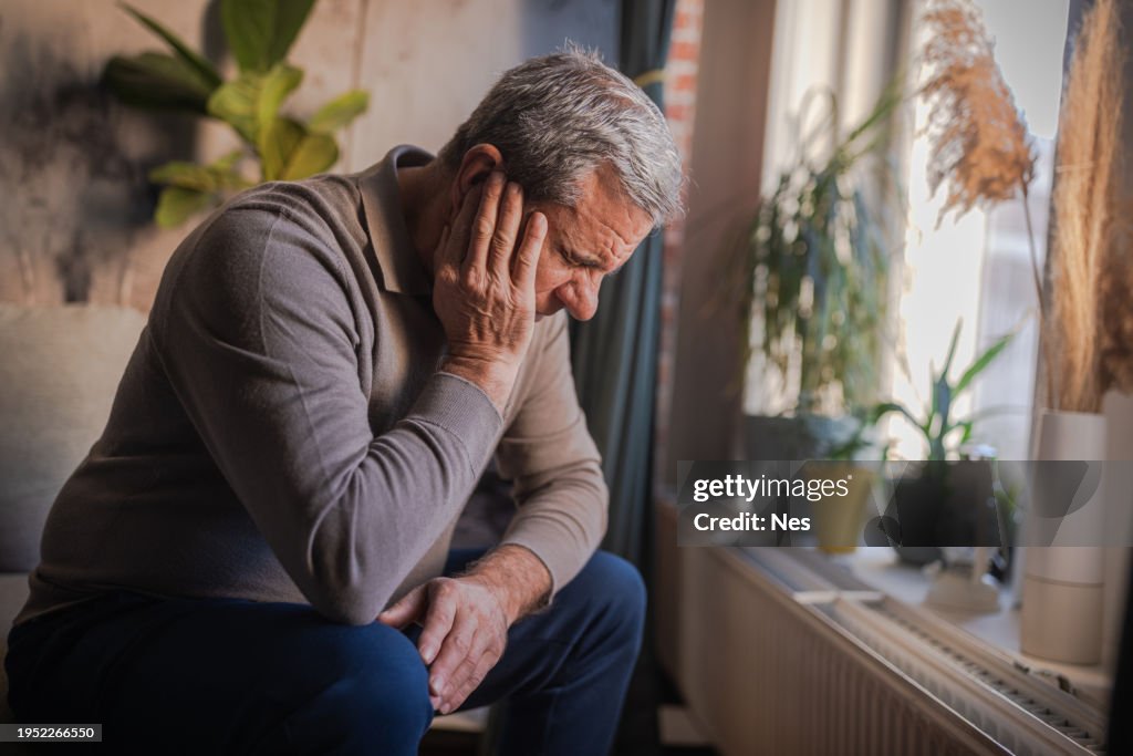 Stressed, unhappy man with severe earache