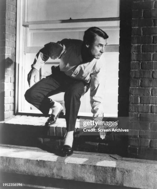 Cary Grant escaping from hospital in a scene from Alfred Hitchcock's 1959 thriller 'North by Northwest'.