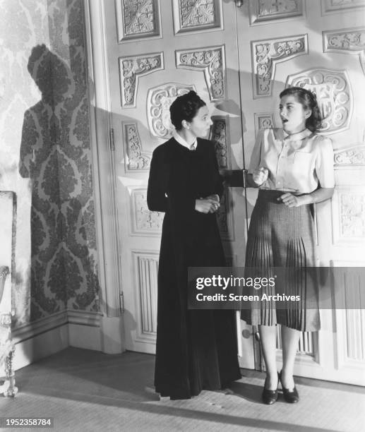 Joan Fontaine and Judith Anderson as Mrs Danvers in the 1940 Alfred Hitchcock thriller 'Rebecca'.