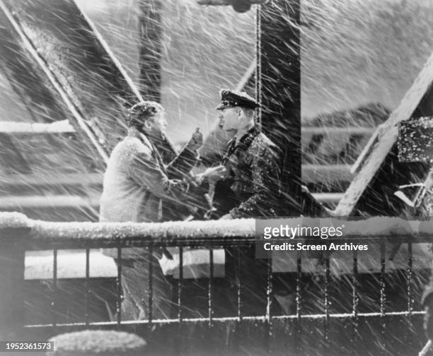 James Stewart and Ward Bond in snow blizzard on bridge in a scene in the 1946 Frank Capra film 'It's A Wonderful Life' .