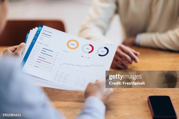 analyzing the numbers: close-up of a financial report in a meeting - bank statement stock pictures, royalty-free photos & images