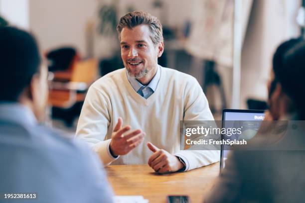 negotiating success: businessman at a hiring meeting - draft first round stock pictures, royalty-free photos & images