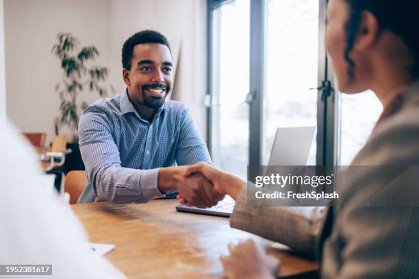 sealing the deal: handshake at a job interview - qualification round stock pictures, royalty-free photos & images