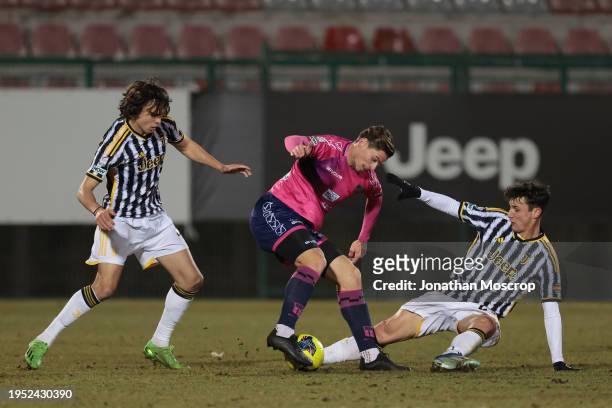 Samuele Damiani and Martin Palumbo of Juventus clash with Federico Marchesi of Rimini FC during the Serie C match between Juventus Next Gen and...