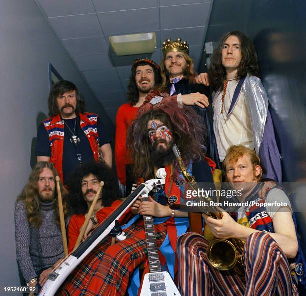 English rock group Wizzard posed backstage in London circa 1972. Members of the band are, top row from left, Mike Burney, Keith Smart, Rick Price and...